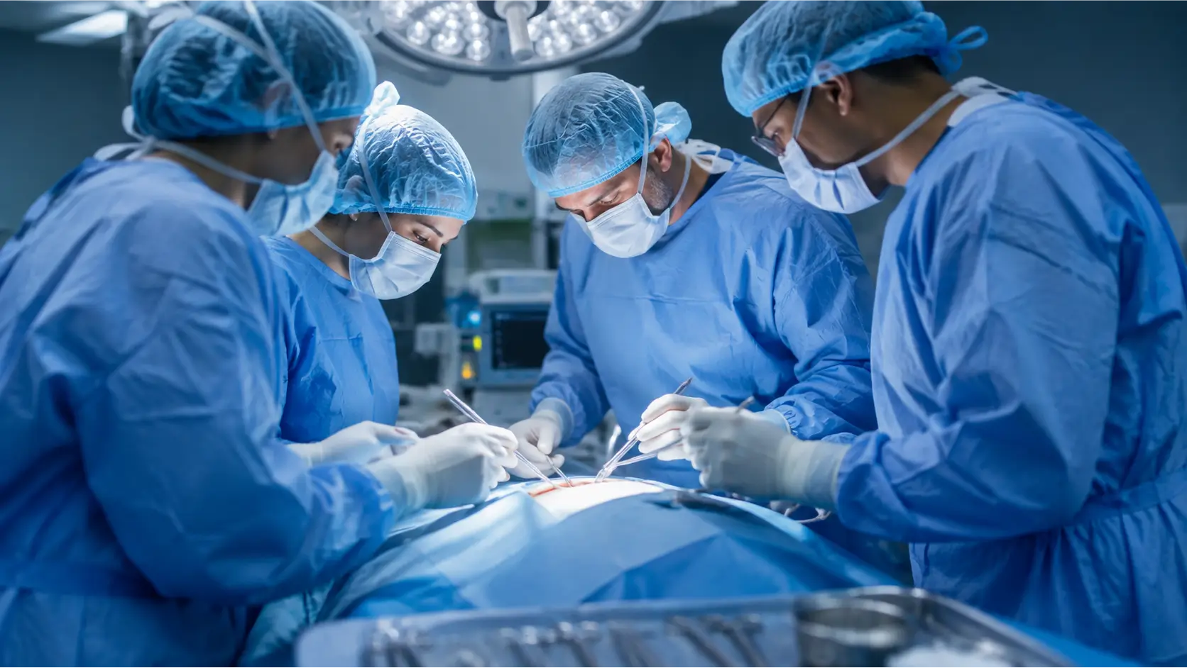 Surgical Team in Operating Room Surgical team in operating room attire performing a medical procedure
